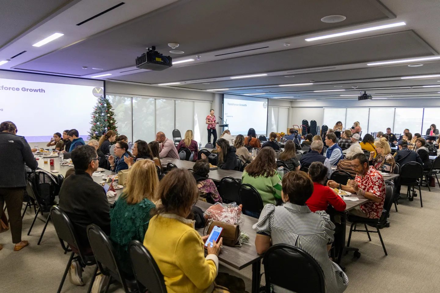 Monthly Tarrant County 5 Stones Taskforce meeting in the Fort Worth Police Officers Association building. Partners, officers, and community members filling the room.